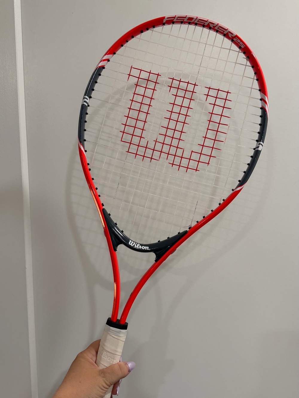 Wilson Red and Black Tennis Racket with White Grip